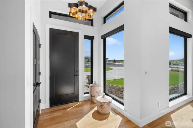 Front entry. Home features Motorized Hunter Douglas Designer PowerView Screen Blinds throughout.