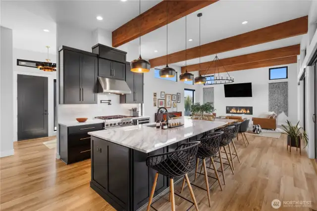 Kitchen featuring huge kitchen island with eat space and storage.