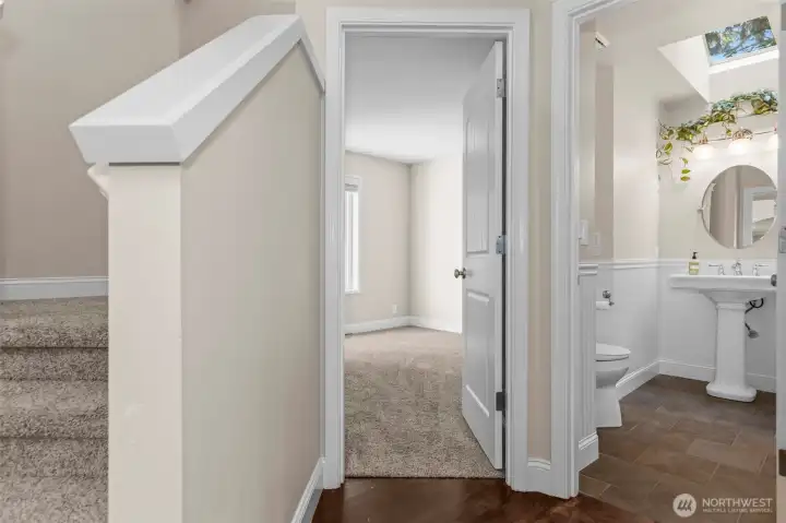 Straight ahead as you enter is the office / den and half bath