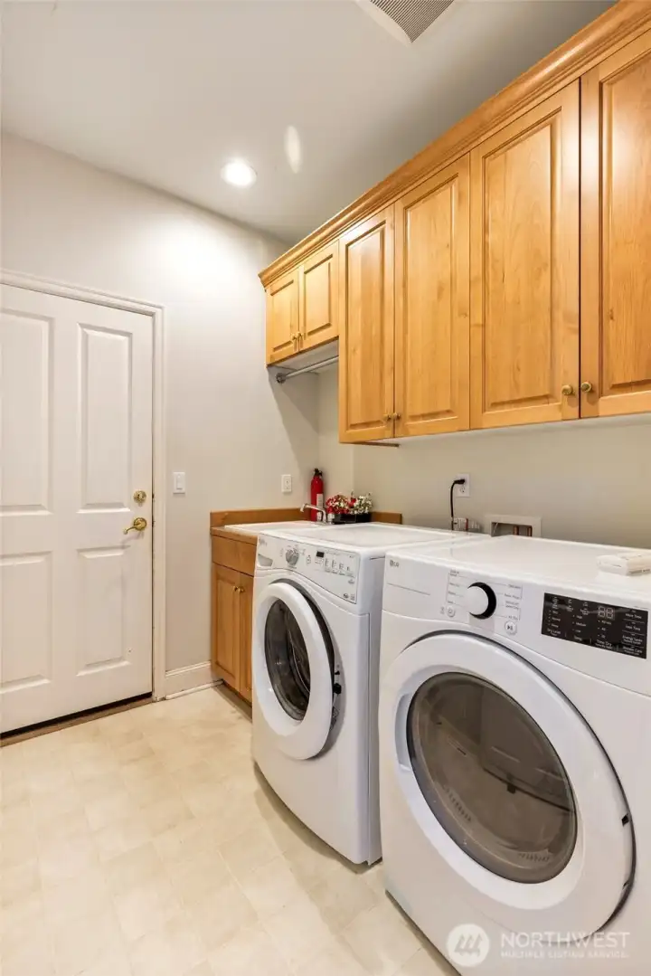 W/D stay. Nice sink area and cabinetry in utility room