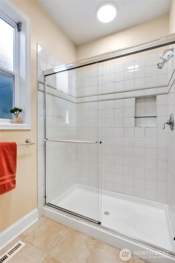 Attached 4 piece primary bathroom with walk-in shower