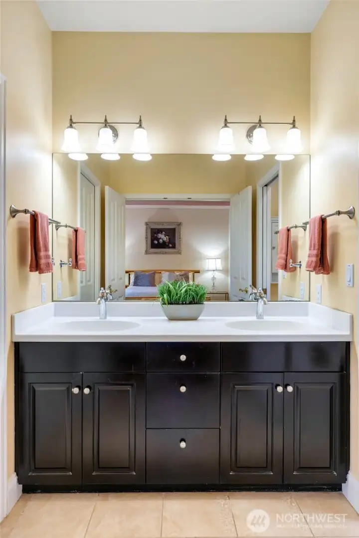 Dual vanity with newer counterops and updates.