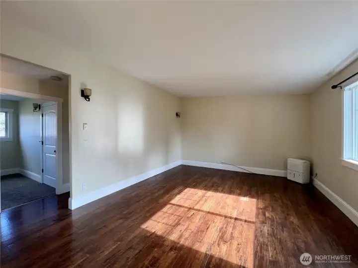 Bright natural sunlight fills this living space in unit 140