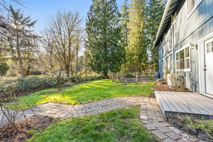Backyard has easy access to the garden for fresh herbs and veggies.