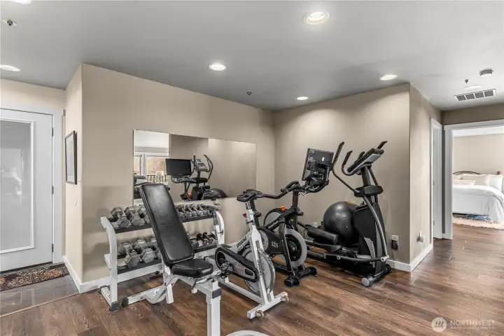 Hobby/work-out area leading to lower yard, 2 additional bedrooms, baths and family room.