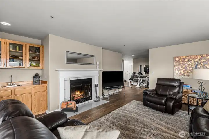 Family room with wood burning fireplace and wet bar.