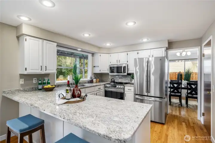 Updated kitchen...stainless appliances, undermount farm sink, breakfast bar, and more!