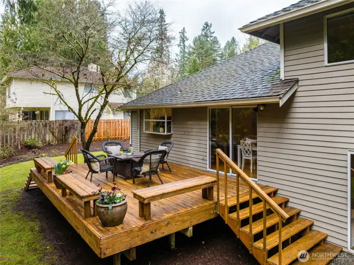 Another great view of the deck. The steps lead down to the family room sliding door.
