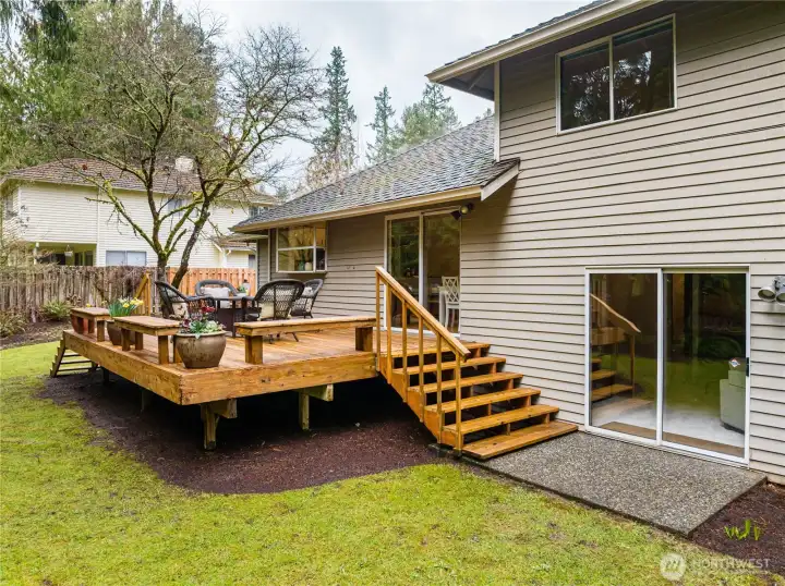 The slider on the deck leads to the kitchen eating area and slider below to the family room.
