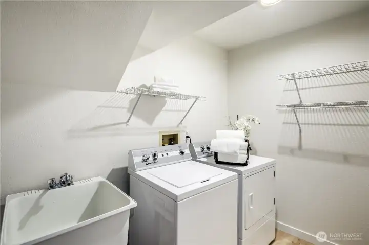 Laundry room with sink and hanging racks.  Washer and Dryer are included!