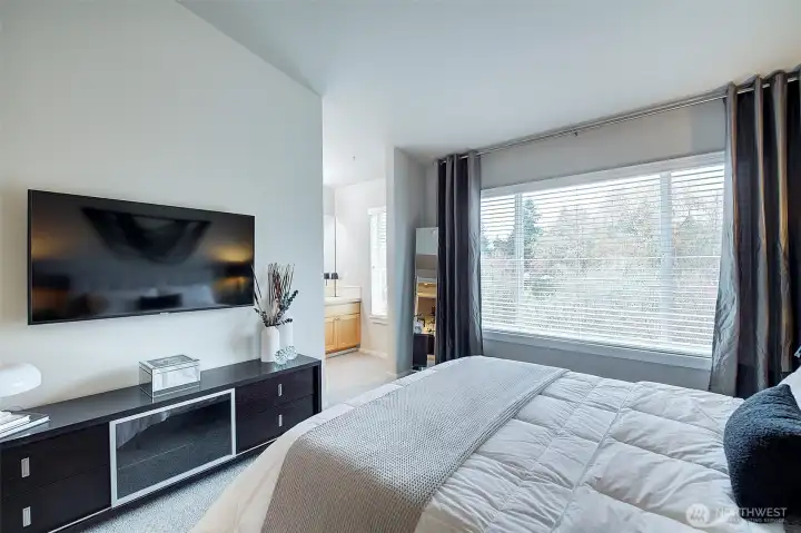 Primary Suite with tree lined view.