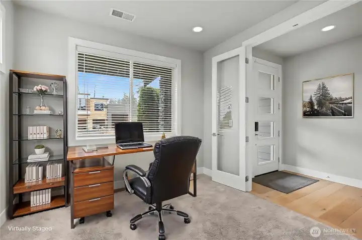 First floor bedroom/office view, I love the large windows looking out and the glass French doors. ***Virtually Staged***