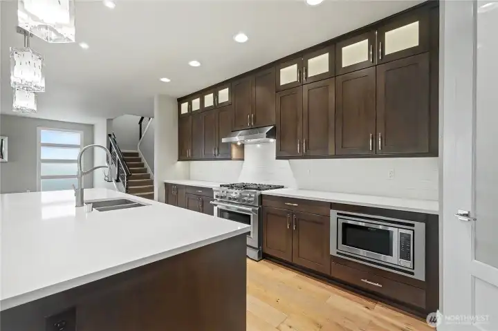 Kitchen view two, a true chef's delight! I love the gas stove and the in-island sinks. You need to see this space with your own eyes to believe it.
