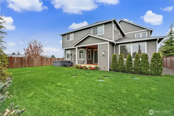 View of the rear of the home from your backyard, this property is simply gorgeous inside and out. Come see it and be IMPRESSED.