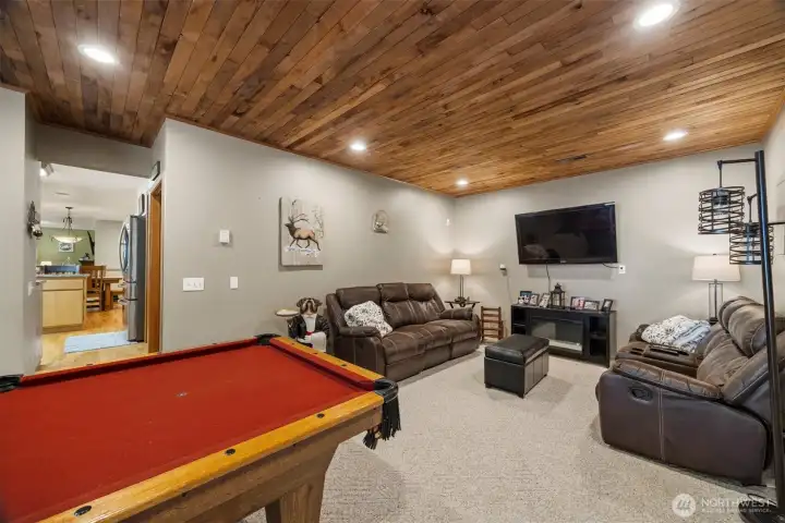 Looking across the pool table toward the kitchen.