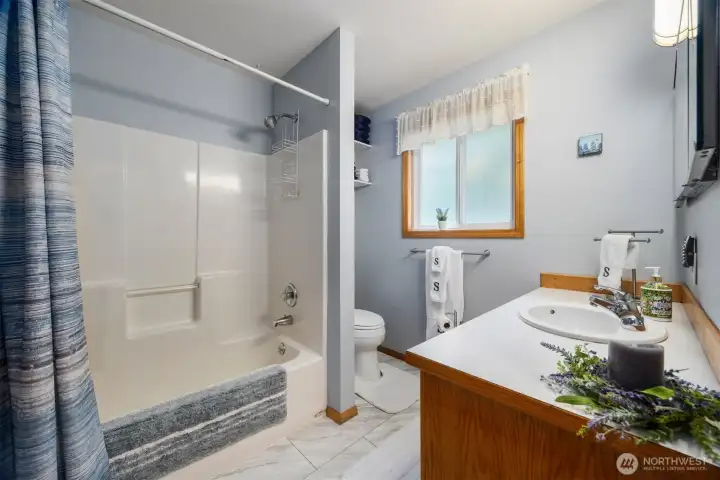 The full bath is near the second and third bedroom.