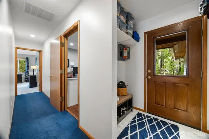 As you come in the back door, the salon which is now used as an office is right around the corner and there is space to hang coats and leave your shoes.