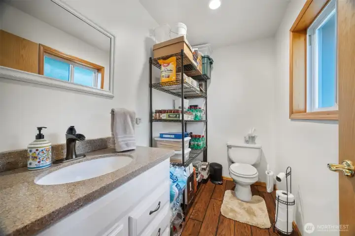 This is the half bath that is off the space which was a salon and now is an office.