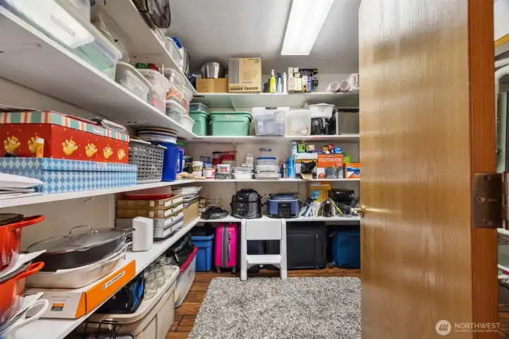 The walk-in storage room/mechanical room is just down the hall near the kitchen and is perfect for auxiliary pantry storage space.