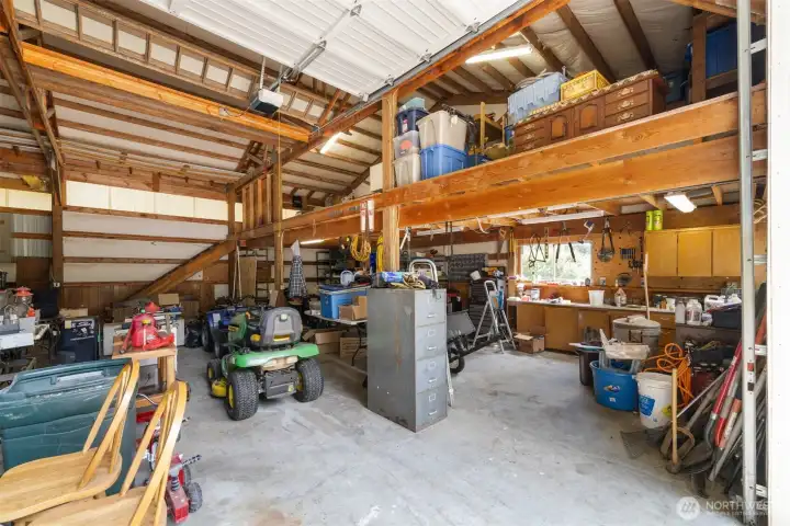 There is a loft for more storage above the work area in the shop.
