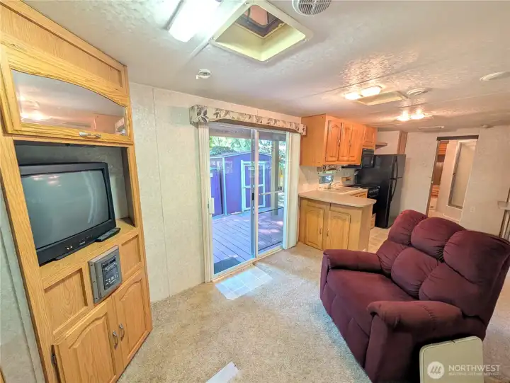 Light and bright living room area with sliding door.