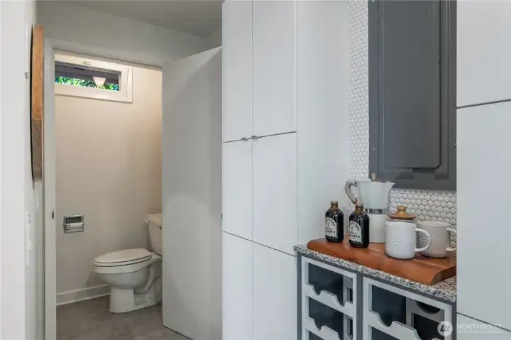 powder room just off of the kitchen