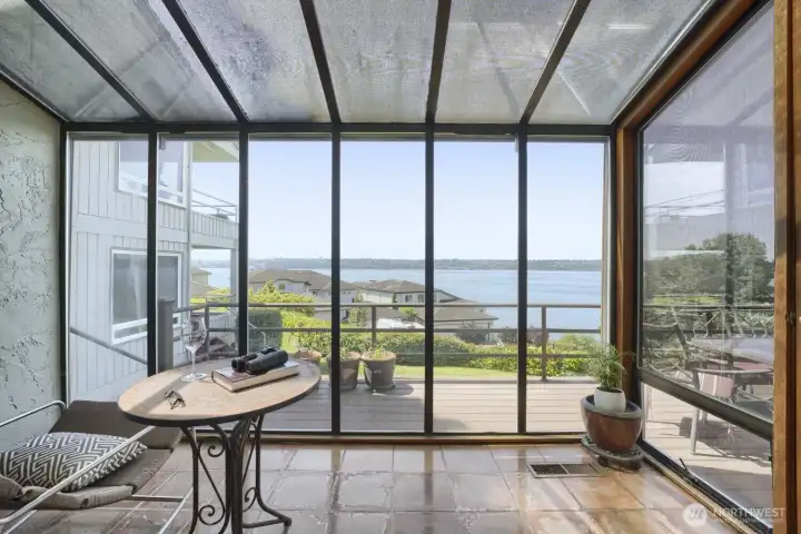 Enclosed sunroom with light-filtering window blinds that provide sun protection without blocking the view. Enclosed sunroom with light-filtering window blinds that provide sun protection without blocking the view.
