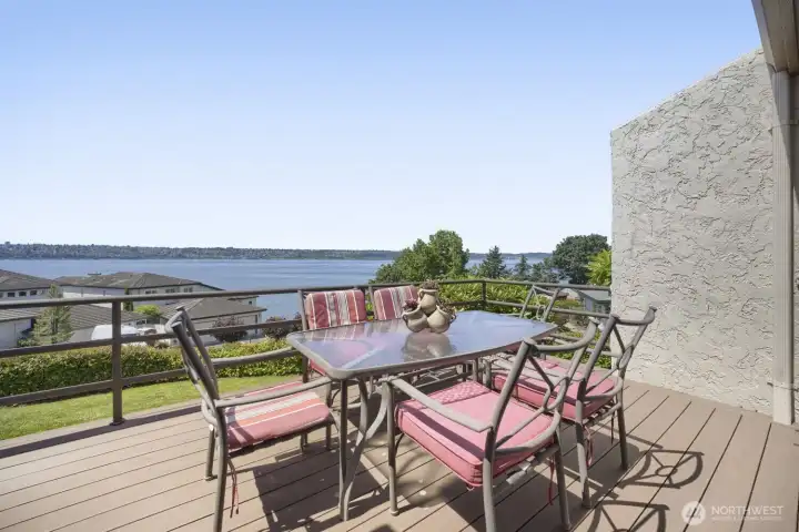 Outdoor deck with seating area and beautiful water views. Outdoor deck with seating area and beautiful water views.