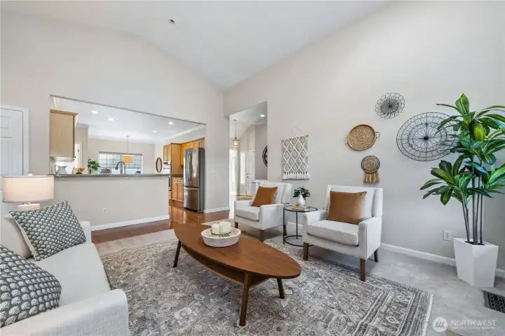 The living room flows seamlessly into the updated chef's kitchen.