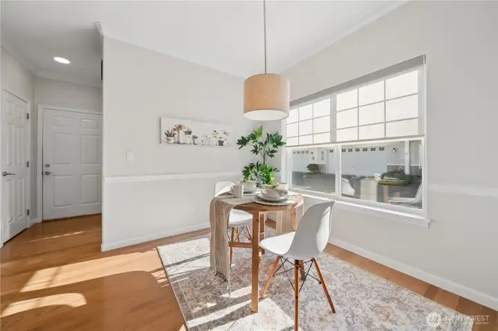 The door to the left leads to an expansive walk-in pantry, while the door straight ahead provides access to the oversized two-car garage.