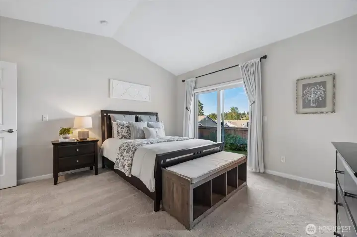 This serene retreat is perfect for rest and relaxation. Vaulted ceilings enhance the sense of space, while sliding doors lead to the private patio—an ideal spot for morning coffee and peaceful territorial views.