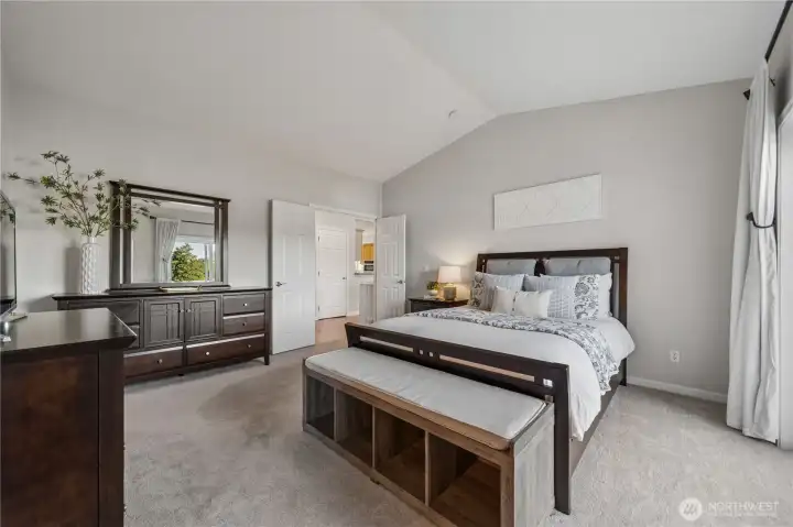 Here you can appreciate the generous size of the primary suite, with room for a king-sized bed and additional furnishings. Notice the elegant French doors as well.