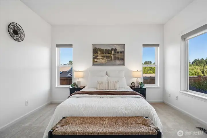 The second bedroom is equally bright, airy, and inviting.