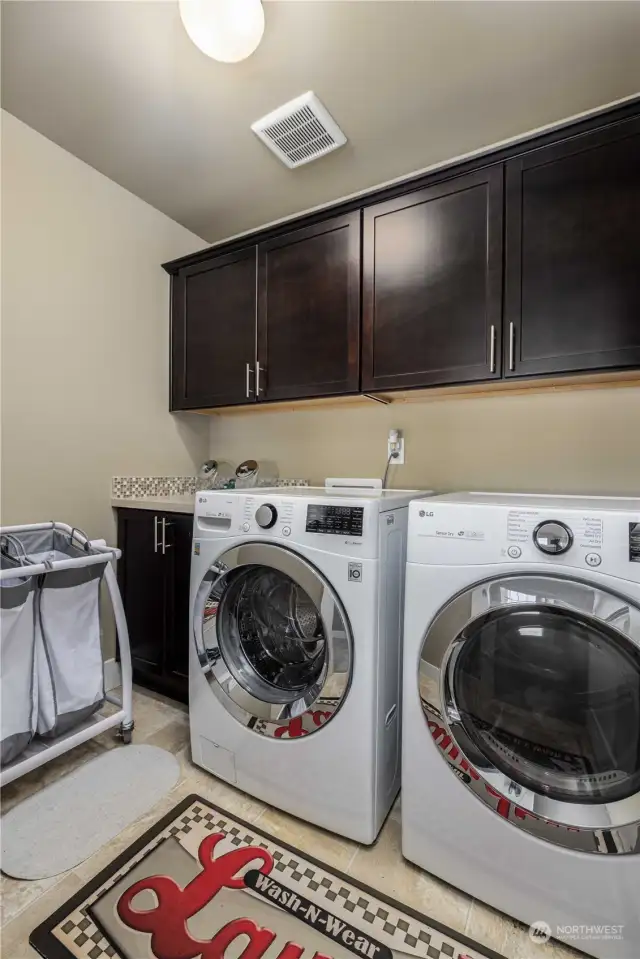 Upper level laundry room with tons of storage