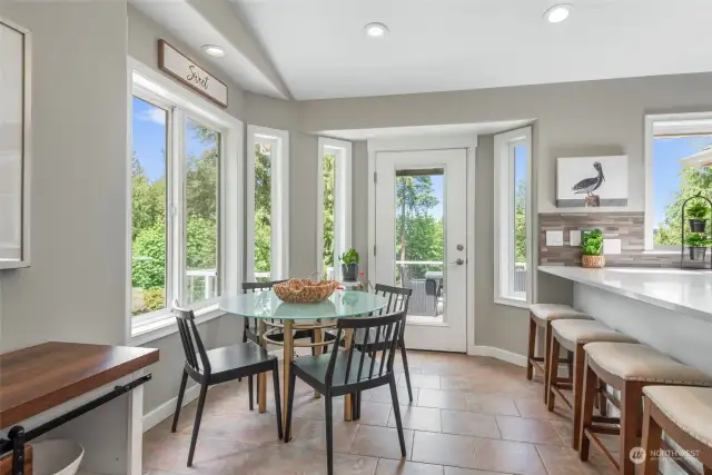 Breakfast nook - surrounded by windows and gives you access to the back deck