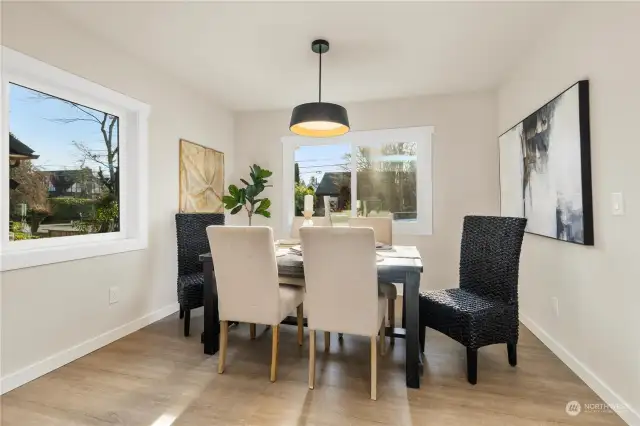 Check out this good sized formal dining room off kitchen with 2 large windows and room for 8-10 guests at the table.  There is more seating at kitchen bar also