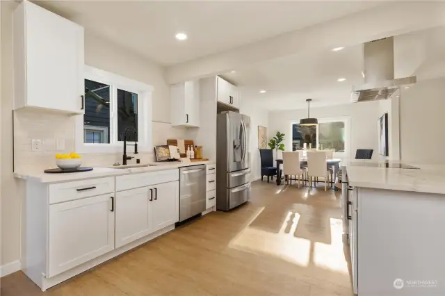What an amazing kitchen that is loaded with newest updates and large refridgerator surrounded by lots of natural light