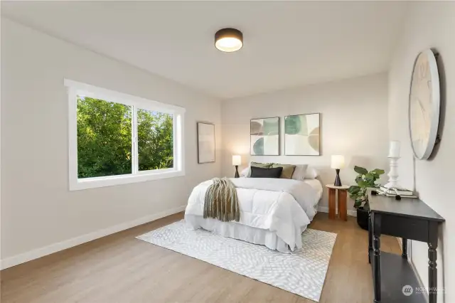 Here is view of bedroom #1 on main level with walk in closets LVP flooring and big enough for all your stuff