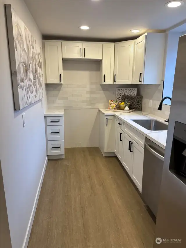 Good sized second wet bar in lower level for guests or family