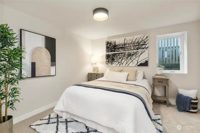 Here is view of bedroom # 4 on lower level with warm carpet and colors with door way to bathroom for easy access