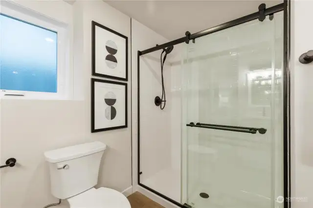 Here is good sizdd 3/4 bathroom on lower level with designer shower that opens to bedroom 4
