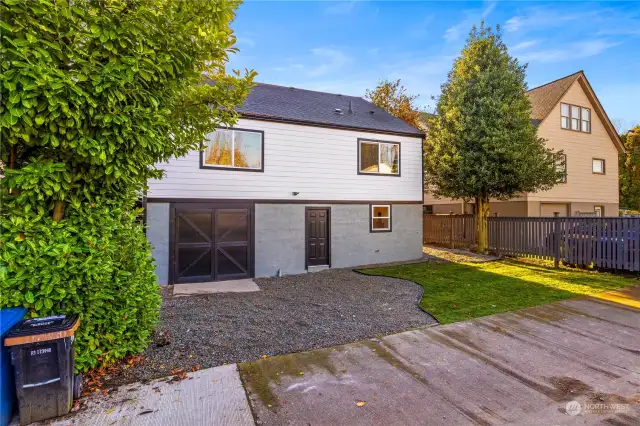 This home has good sized ally access to back of home and back yard to.  There is access through door for guests or possible rents to use also