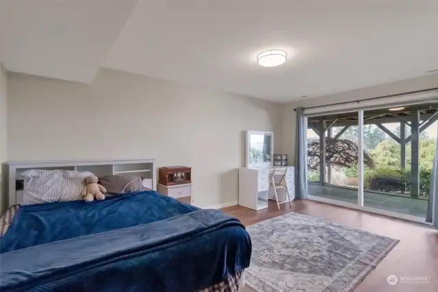 Lower bedrooms include sliding glass doors to enter into the backyard space.