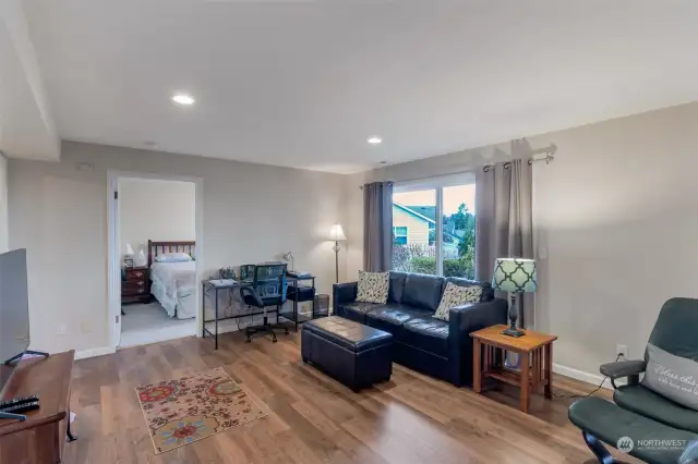 Inside the Apartment - Spacious living room. Luxury Vinyl Plank flooring throughout except the bedroom.