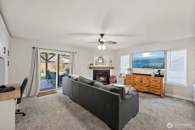 Lower level family room with built-ins, fireplace, half bath and laundry room