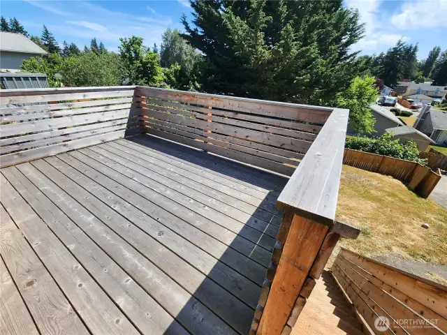 Deck leads down to backyard