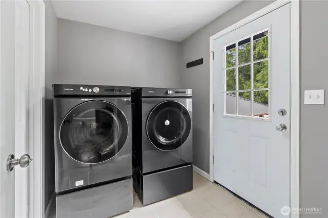 Main floor utility room washer and dryer convey with the sale