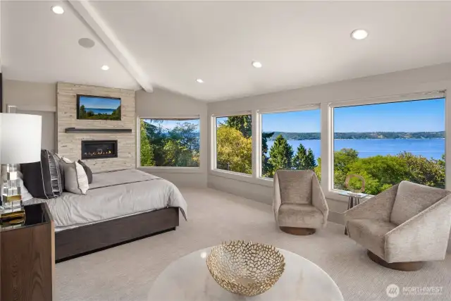 Huge primary bedroom with a wall of windows to maximize the views