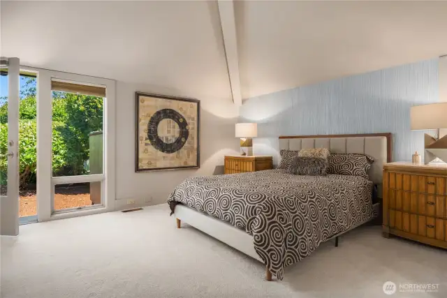 Bedroom on the main floor with vaulted ceilings, private entrance and shared 3/4 bath