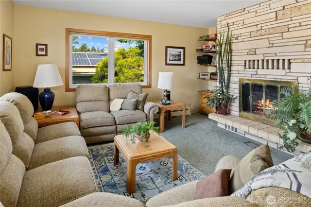 Beautiful rock fireplace located in the living room.